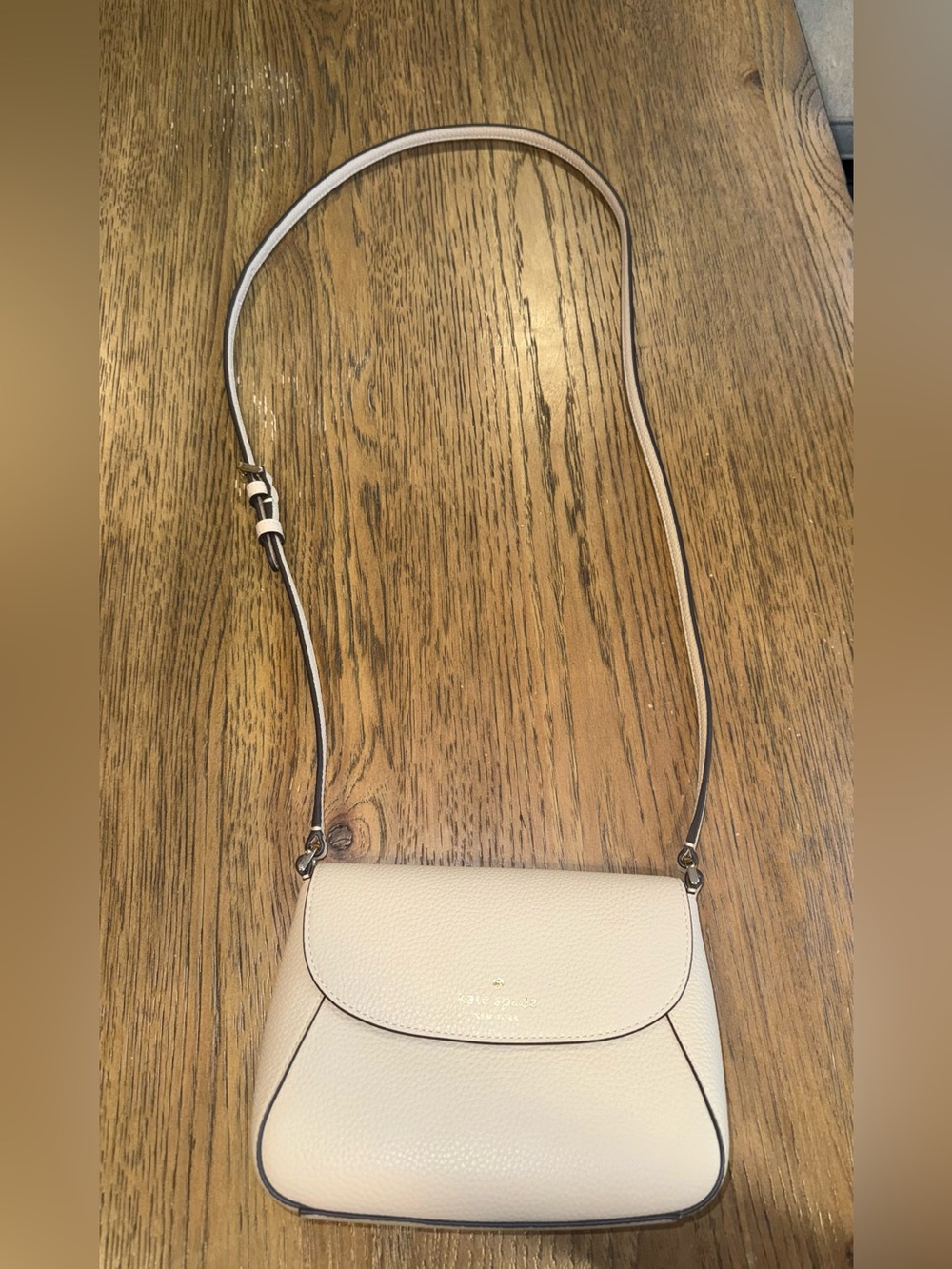 kate spade cream leather crossbody with gold-tone logo
